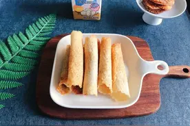 让你停不下筷子的#蛋趣体验#蛋白芝麻蛋卷图片