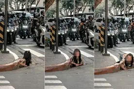 女子从菲律宾闹市排水道爬出，画面惊悚像恐怖电影图片